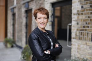 Aedín Gormley facing the camera with her arms crossed 