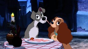 Two cartoon dogs eating spaghetti